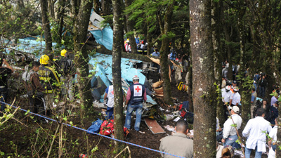  Members Of The Red Cross Search The Wreckage